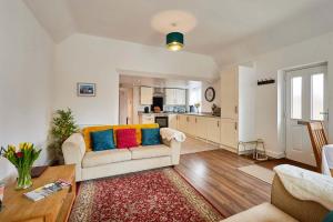 a living room with a couch and a table at Host & Stay - Beagle Barn in Withington