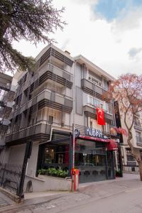 a building on a street with a krispy kreme at Cadde 7 Otel in Bahçelievler