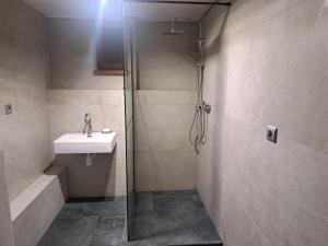a bathroom with a shower and a sink at Rajecká chata in Rajecká Lesná +15 photos