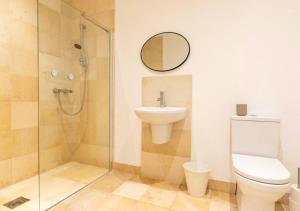 a bathroom with a toilet and a sink and a shower at Spacious 3 bed, Parking, Long stays welcome, Relocators, Families, Contractors in Knaresborough +32 photos