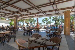 an empty patio at a restaurant with tables and chairs at Seven Seas Hotel Life - Ultra All Inclusive & Kids Concept in Kemer