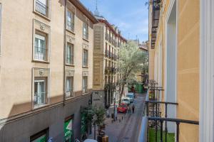 a view from a balcony of a street with buildings at Abalú Collection Hotel Boutique Gran Via in Madrid