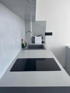 a kitchen with a sink and a counter top at MIRA house in Ios Chora