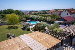 an aerial view of a backyard with a swimming pool at My Nest Accommodation in Privlaka