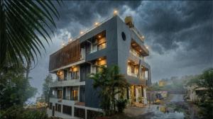 a rendering of a building with a river in the background at Omkar Hotel - Mahabaleshwar in Panchgani