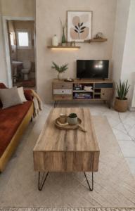 a living room with a couch and a coffee table at Kerkis View House-Garden View in Karlovasi