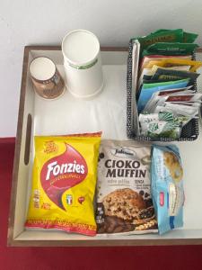 a drawer with some food and other snacks on it at Hotel Beretta in Perledo +11 photos