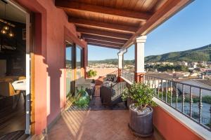 a balcony of a house with a view at 3 MURA rooms in Teulada