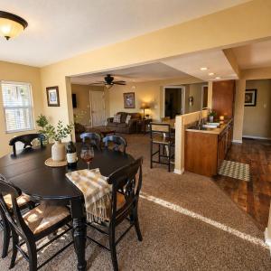 a living room with a table and a kitchen at Buccaneer Bay #28 - Beachfront Bliss in Sunrise Beach