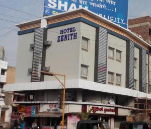 a building with a hotel battle sign on it at Hotel Zenith in Surat