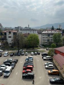 a parking lot full of cars in a city at Koncept RK in Banja Luka +36 photos