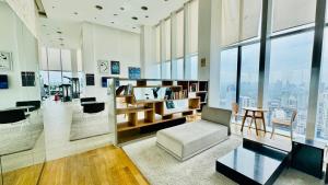 a living room with a couch and a table at Platinum Astern SUITES by KLCC in Kuala Lumpur