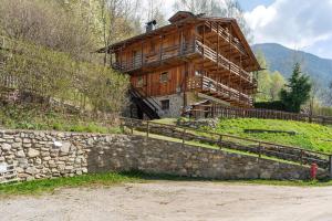 a large wooden house on top of a hill at Loft Panorama By Immobilux in Rabbi