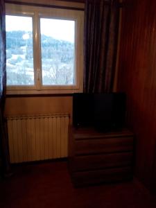 TV a/nebo společenská místnost v ubytování Lamour