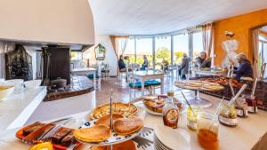 a buffet with many different types of food on display at Hotel La Tramontane in Saintes-Maries-de-la-Mer