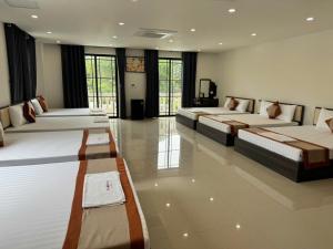 a large room with two beds in it at Luxury Hotel in Tây Ninh