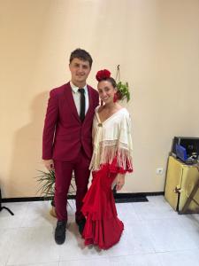 a man and a woman in a dress posing for a picture at SEVILLE YOUR WAY in Seville