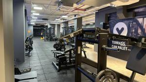 a gym with rows of treadmills and machines at Hotel Terrassa Confort in Terrassa