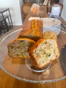 four slices of bread on a glass plate on a table at couleurs d'ici in Fleurance +20 photos