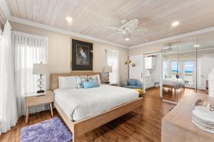 a bedroom with a bed and a living room at Pet Friendly Beachfront Home - Casa Bella Del Sol in Cape San Blas +64 photos
