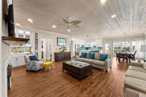 a living room with a couch and a table at Pet Friendly Beachfront Home - Casa Bella Del Sol in Cape San Blas