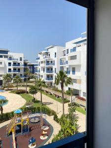 a view from a window of a playground at Luxury Apartment in martil in Martil