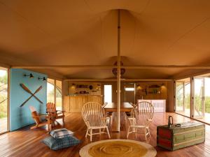 a living room with chairs and a table at Camp Canoe in Franschhoek