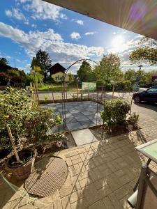 a view of a garden with a gate and some plants at LA-Hüttenfeld Erdgeschoss Apartment in Lampertheim
