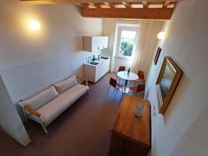 a living room with a couch and a table at Appartamenti - AL4 in Guardistallo
