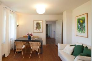 a living room with a couch and a table at Lake View - Flensburger Förde in Westerholz