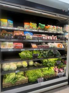 a produce section of a store filled with vegetables at Pizzo Sabbia di Marinella in Pizzo