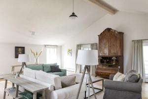 a living room with a couch and a table at Ostseehof-Kernhof in Pommerby