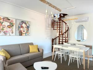 a living room with a couch and a table at Salt Beach Apartments B in Viana do Castelo