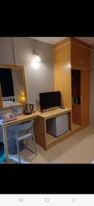 a desk with a computer and a laptop on it at AT home hotel in Hua Hin +22 photos