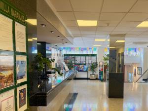 a hallway of a building with a store at Hotel Villa Naranjos in Jávea