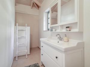 a white bathroom with a sink and a ladder at Villa Athena in Agios Nikolaos +4 photos