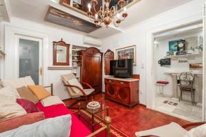 a living room with a couch and a tv at Mia Casa Dubrovnik in Dubrovnik