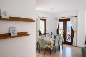 a dining room with a table and chairs at Villa Noa Amazing Sea view in Kaş