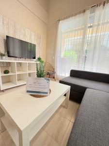 a living room with a couch and a white coffee table at Ocean Corner Dúplex Empul in Los Caños de Meca
