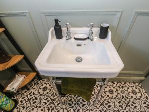 a bathroom with a white sink in a room at Underview in Holmfirth +28 photos