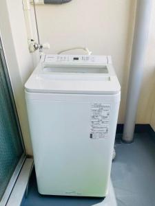 a white water cooler sitting in a room at Nono in Takamatsu