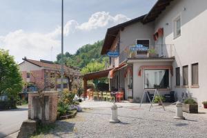 a building with a patio in a town at Terraluna in Monforte dʼAlba