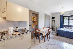 a kitchen with a table and a dining room at Terraluna in Monforte dʼAlba
