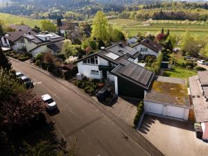 an aerial view of a house with solar panels on it at Alm-Atelier in Durbach