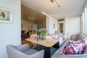 a living room with a couch and a table at Alm-Atelier in Durbach