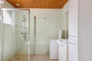 a bathroom with a shower and a toilet and a sink at Gîte La Chapelière in Assay +14 photos