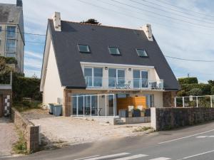 a house on the side of the road at Gites Au Point De Vue in Perros-Guirec