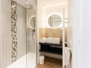 a bathroom with a sink and a mirror at Gites Au Point De Vue in Perros-Guirec +37 photos