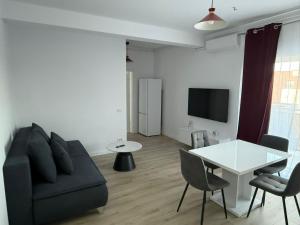 a living room with a couch and a table at VISAJ Escape in Timişoara