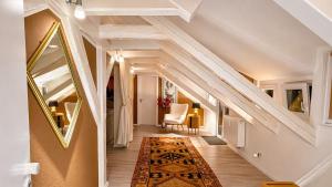 a staircase in a home with a white stair case at Kungs Ferienwohnung 2 in Cottbus